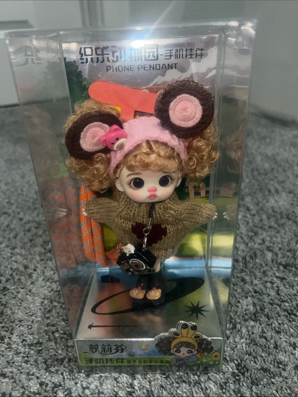 Luolifen (or Loli Fen) BJD (Ball Jointed Doll) phone pendant.